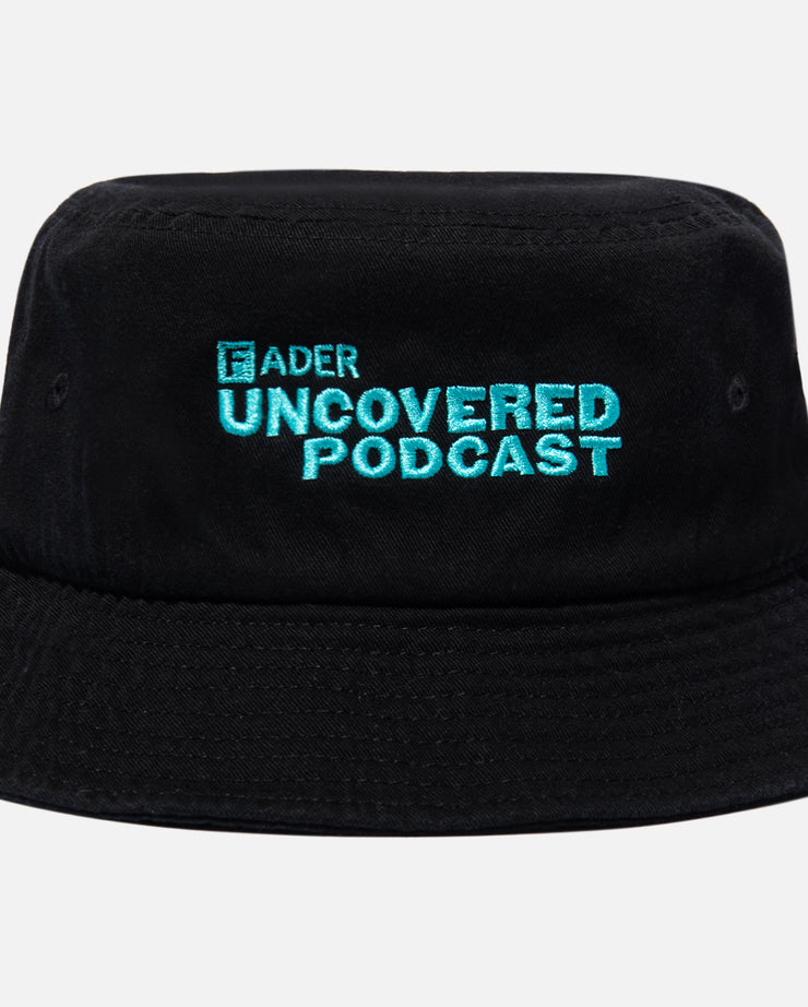 close up of black bucket hat with FADER Uncovered Podcast embroidery