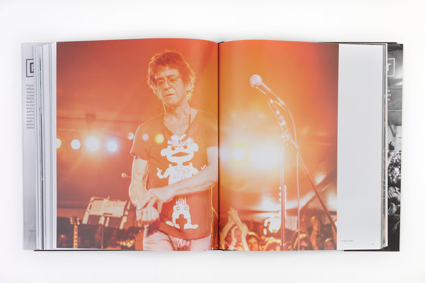 book opened to pages of male artist on stage