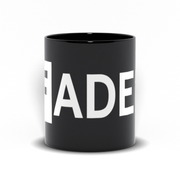 black mug with FADER logo